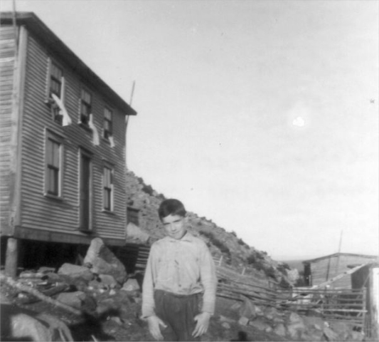 678: Joseph Norman. Joseph Kerrivan's house at left. At Margarees Cove, Red Island. (circa 1955) [courtesy of Jenny (Kerrivan) Harvie]  - Son of John Norman &amp;amp; Mary Farget
